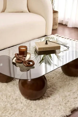 Table basse verre fumé bords arrondis 4 pieds boule KOCHI Commander Vite